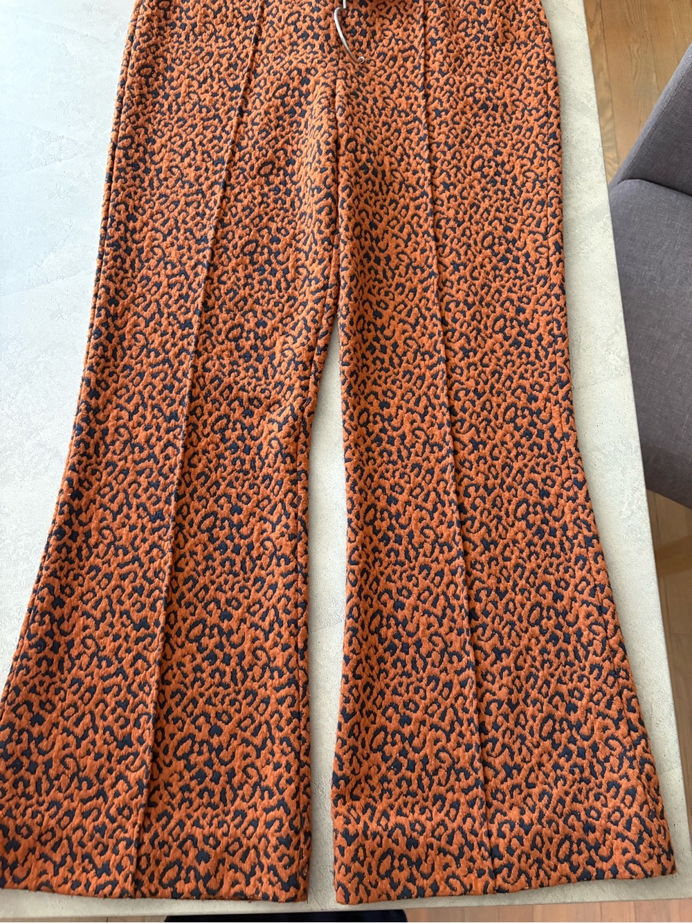 Anthropologie Orange and Black Leopard Flare Pants
